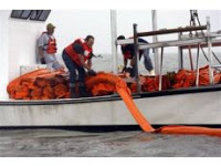 Local captains placing booms to protect our beaches.